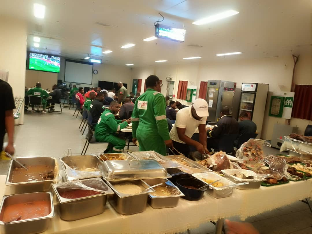Crew served at the buffet line during a shift meal in the client mess